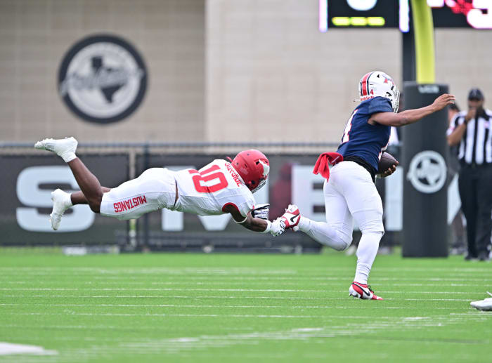 Jarvon Coles, North Shore senior, dives at an opponent during the Mustangs' win over Atascocita in October.
